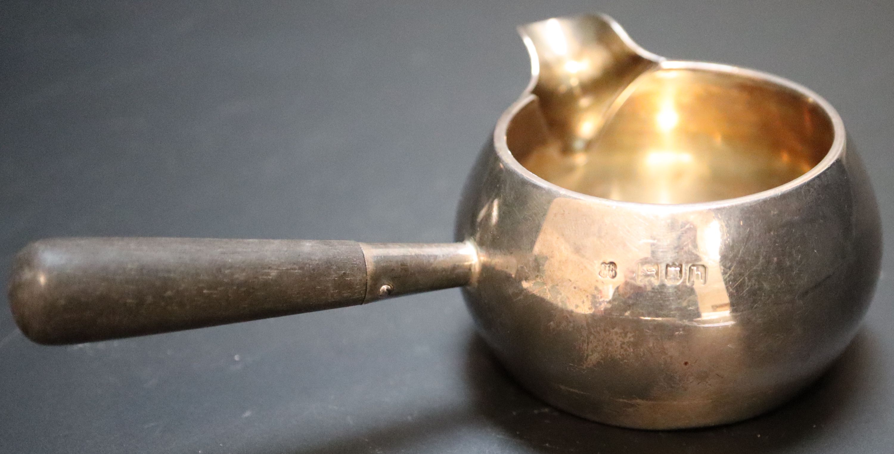 An Edwardian silver brandy warmer and stand with burner, height 11.4cm, gross 5.5oz.